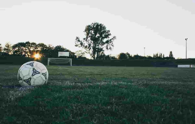 a quiet football pitch in the evening sun